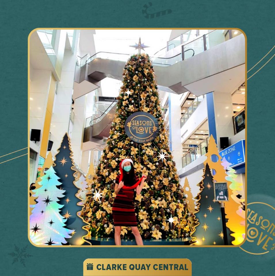 A towering, beautifully decorated Christmas tree at a mall atrium.