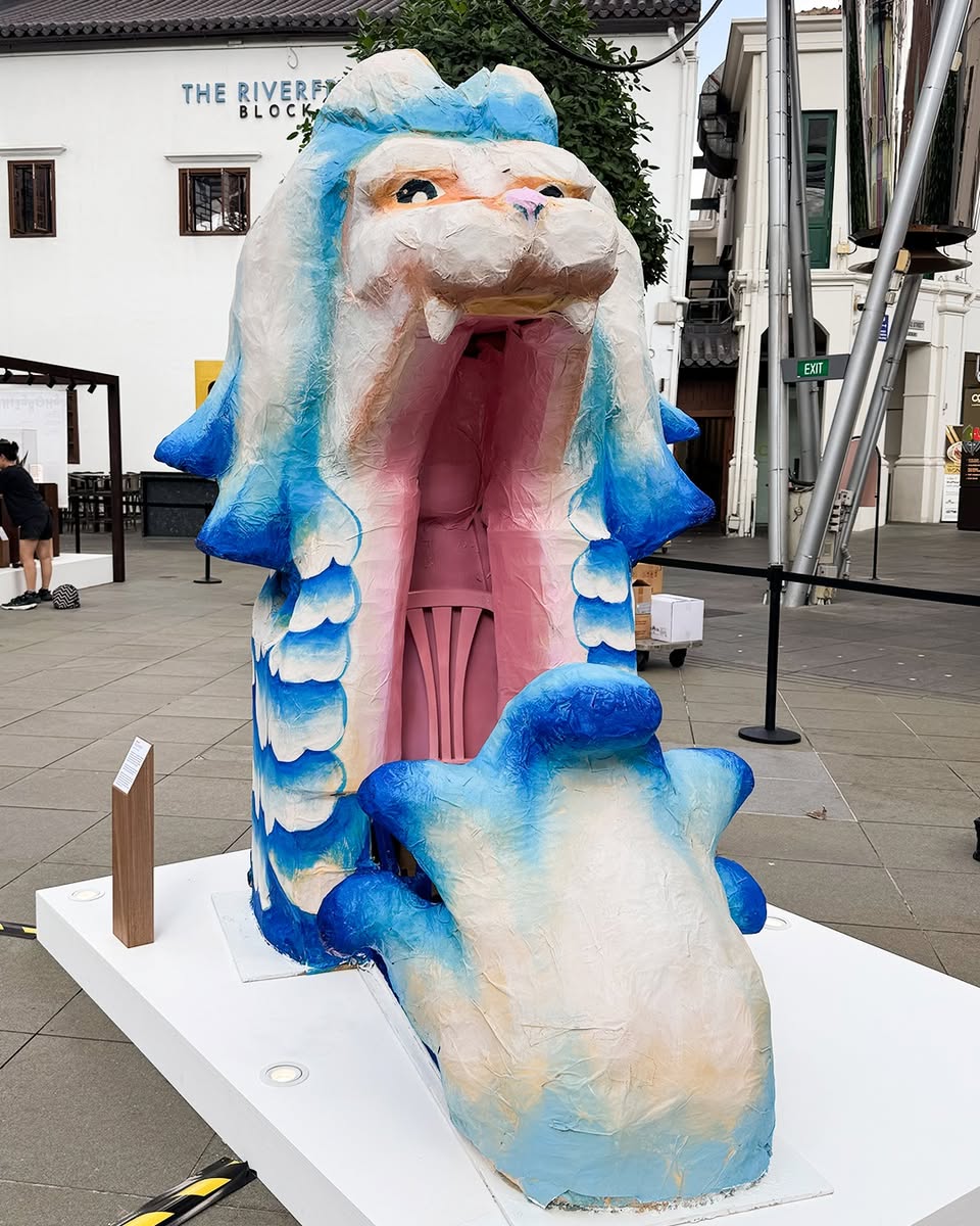 Visitors engaging with the Merlion art installations.