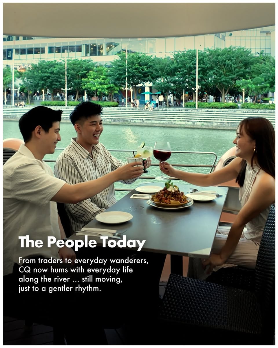 Vibrant riverside scene at Clarke Quay at night, showcasing lights and bustling activity.