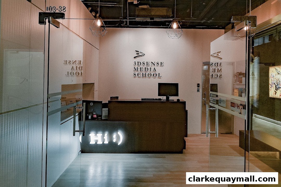The reception area of 3dsense Media School with a modern desk and signage.