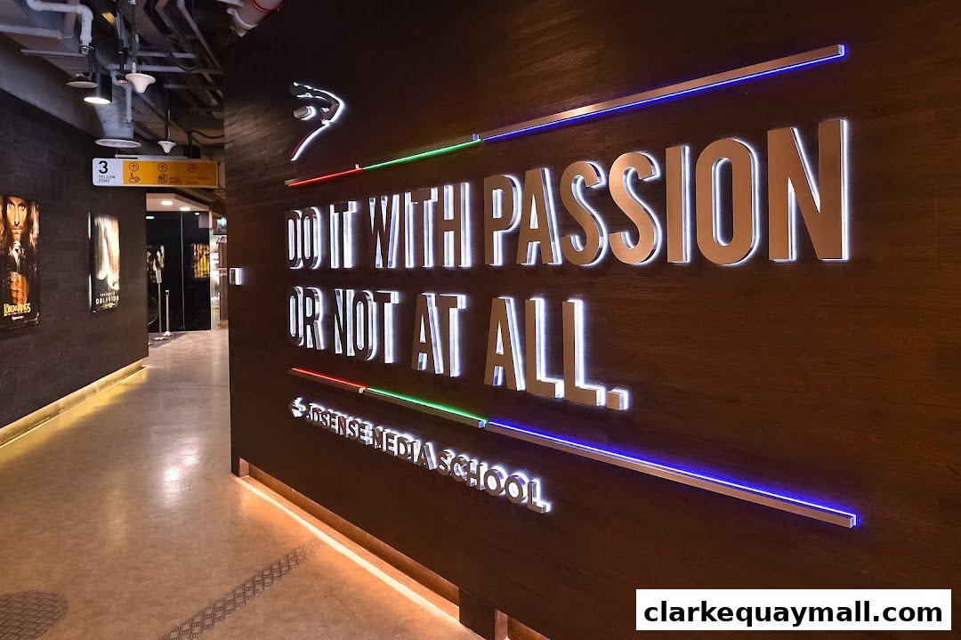 A hallway with movie posters and a large illuminated quote on a wooden wall.