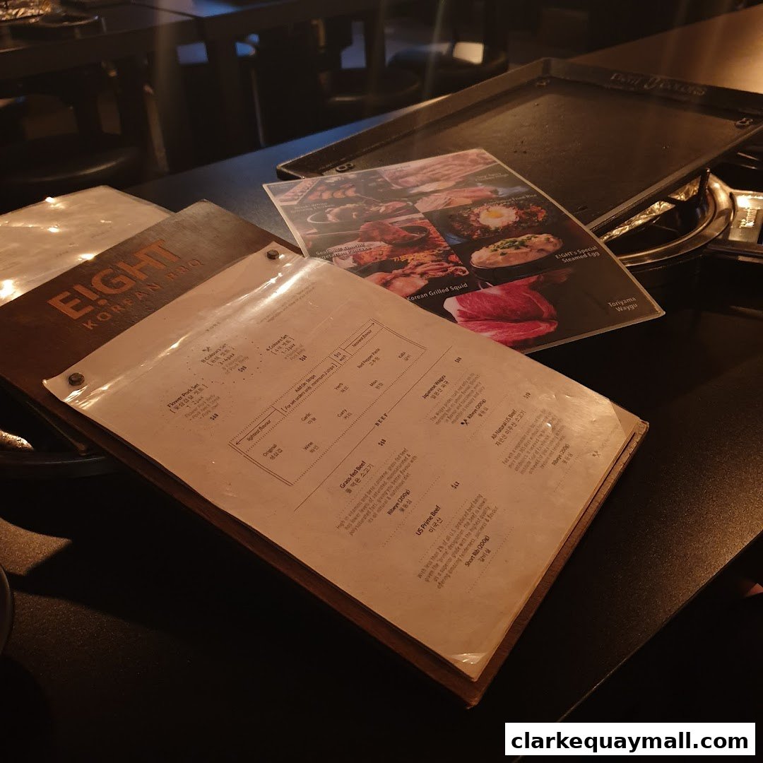 A menu from Eight Korean BBQ with various meat and seafood options.