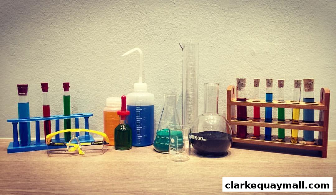 A collection of colorful liquids in various laboratory glassware, including test tubes, beakers, and flasks.