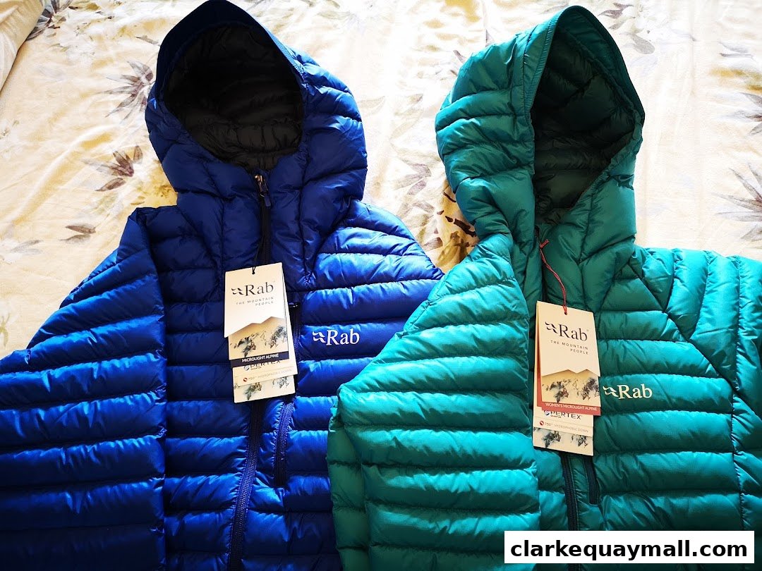 Two Rab down jackets, one blue and one teal, displayed with tags.