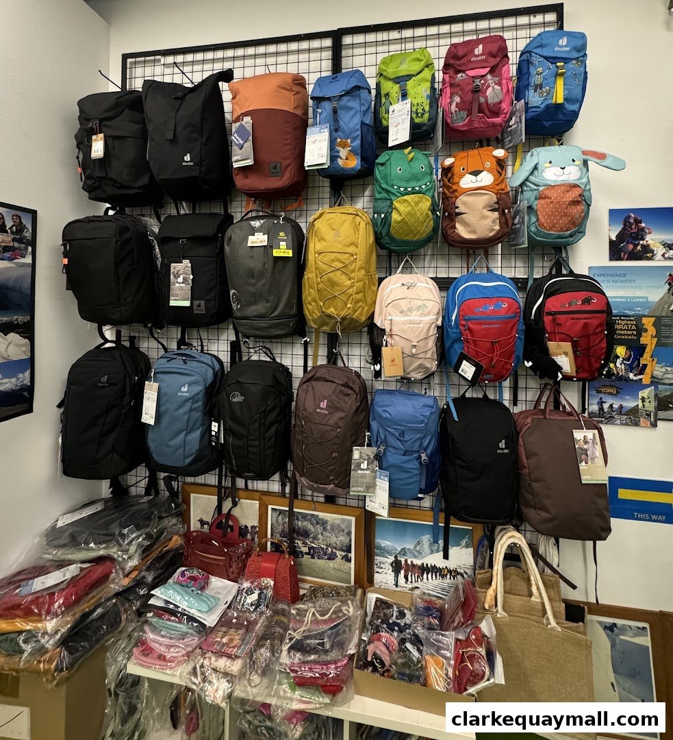 A retail shop displaying a wide variety of backpacks and bags for sale.