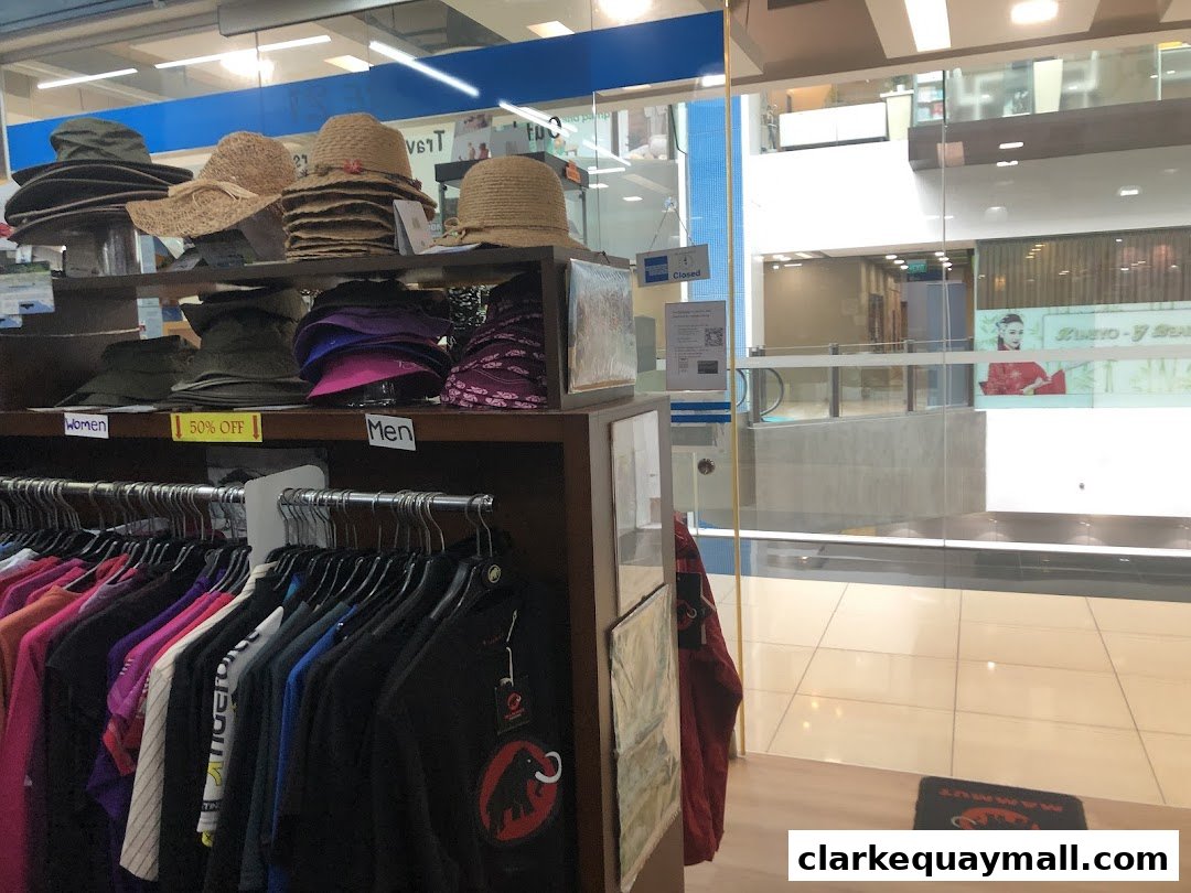 Adventure 21 shop interior with hats and clothing displayed, viewed from the entrance.