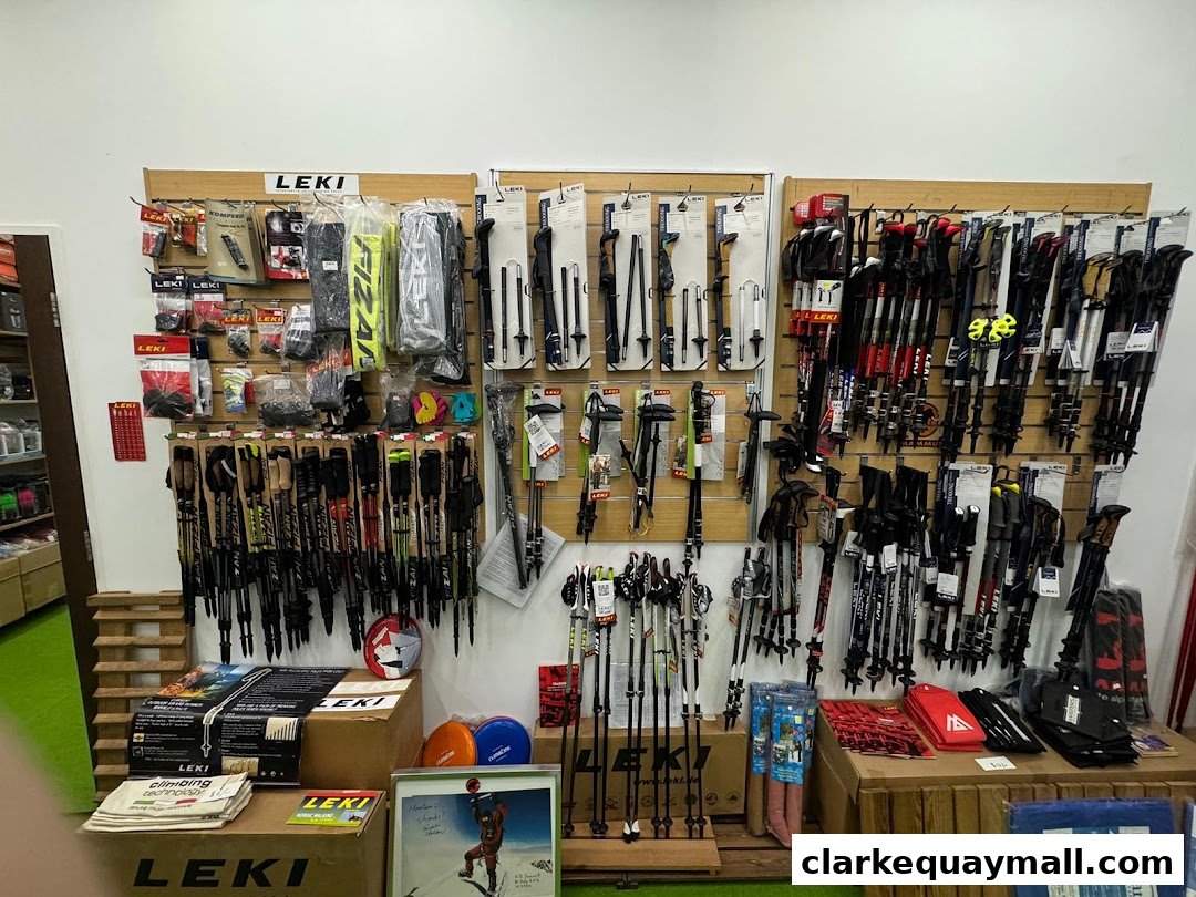 A wall display of Leki brand trekking and ski poles, along with accessories.