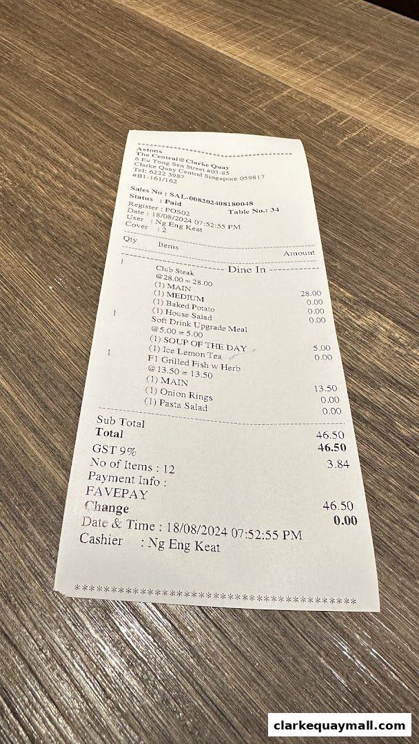 A receipt from ASTONS Specialities showing a meal with steak, fish, and sides.