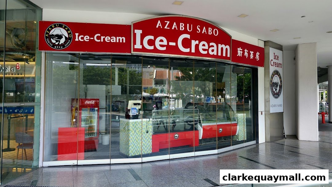 The storefront of Azabu Sabo, an ice cream shop, featuring a red and white sign and glass windows.