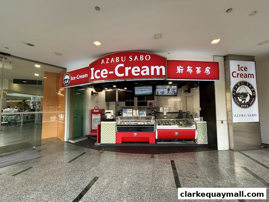 The exterior of Azabu Sabo, an ice cream shop, with its prominent signage and display freezers.