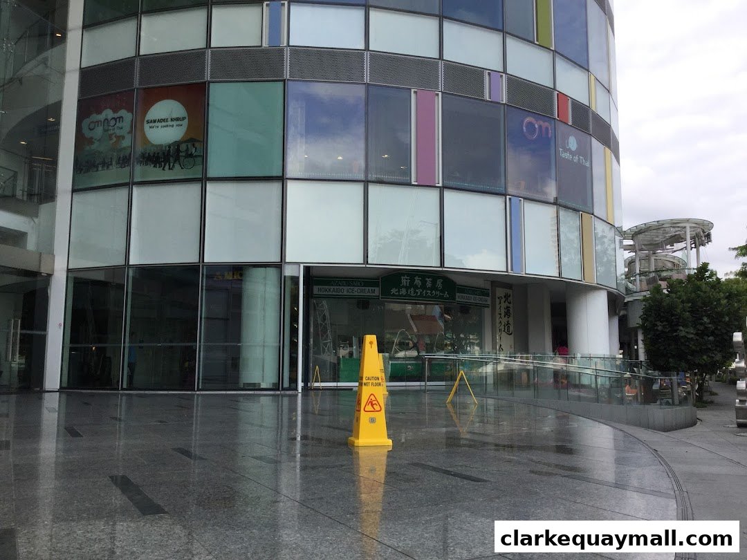 Exterior view of Azabu Sabo Clarke Quay Singapore, featuring its glass facade and signage.