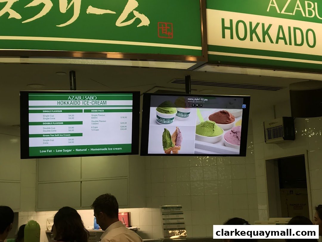 A digital menu board displays Azabu Sabo Hokkaido Ice-Cream with prices and flavors.