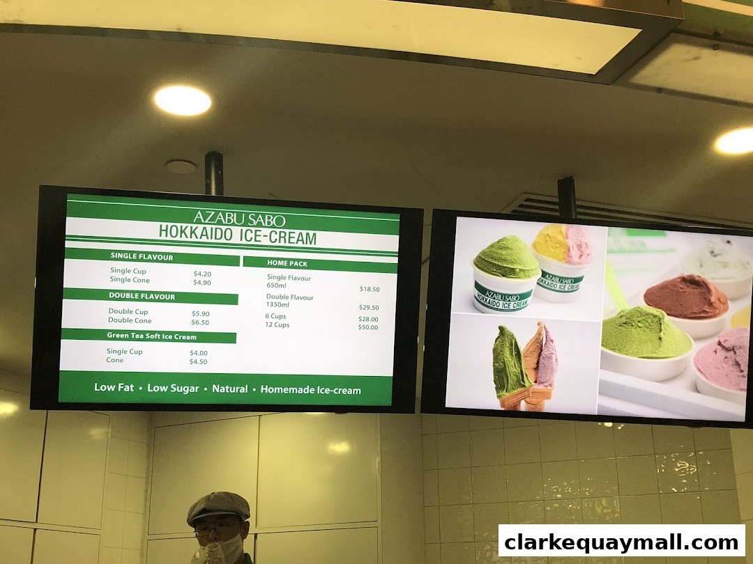 A digital menu board displaying Azabu Sabo Hokkaido Ice-Cream flavors and prices.