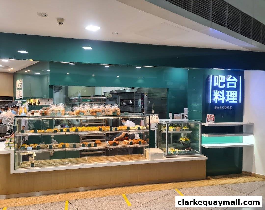 A Barcook Bakery shop with a display of fresh bread, pastries, and cakes.