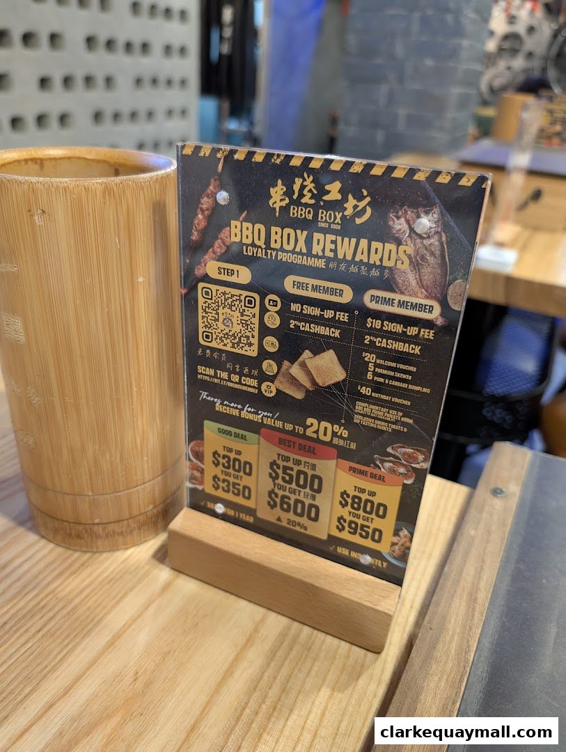 A loyalty program flyer for BBQ Box with various top-up deals and benefits.