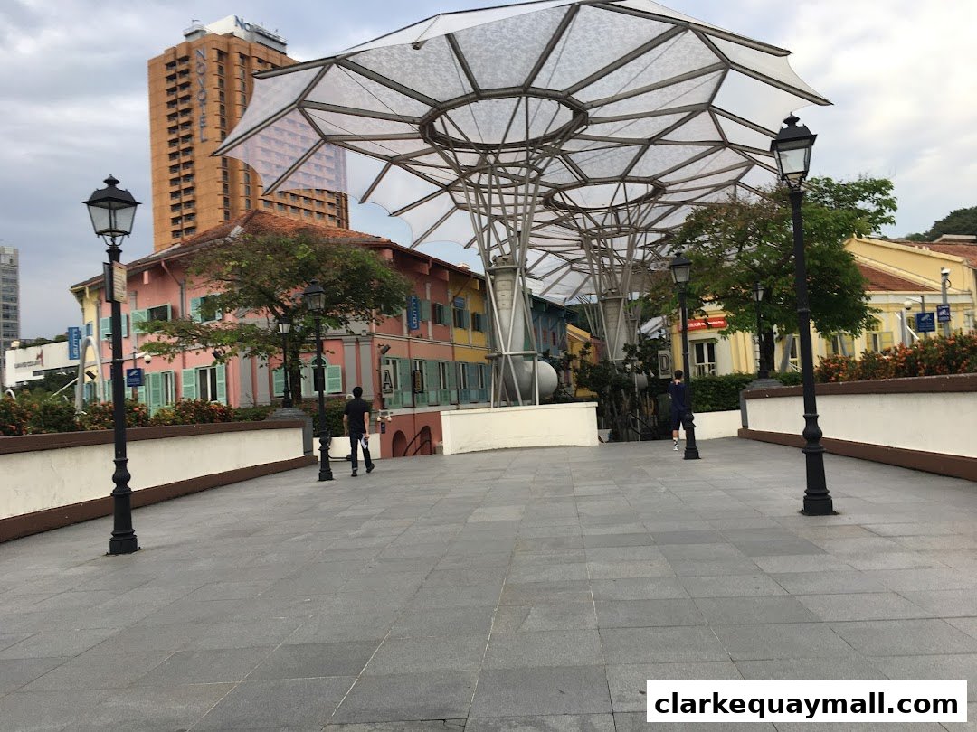 A pedestrian walkway with colorful buildings and a modern canopy structure.