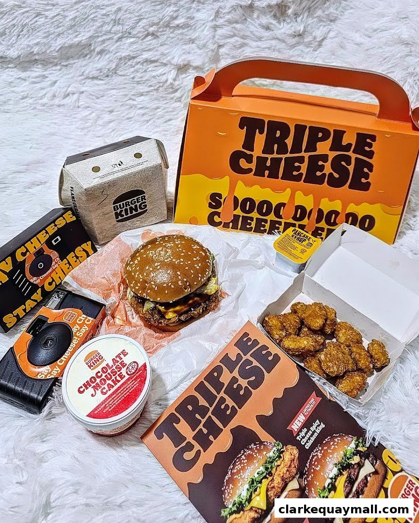 A spread of Burger King food items including a burger, chicken nuggets, and dessert.