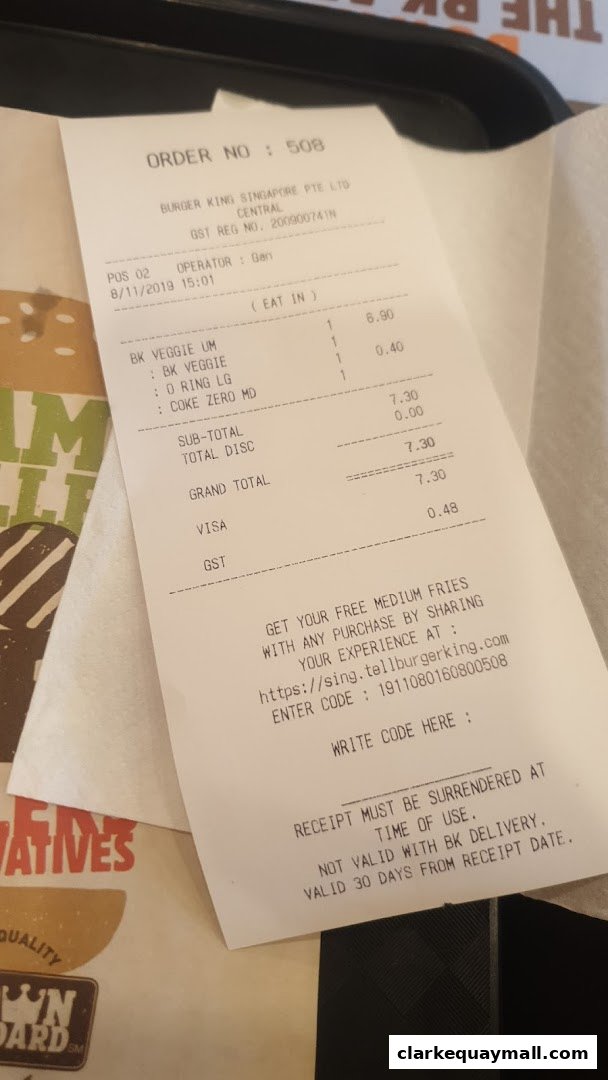 A Burger King receipt showing an order for veggie burgers and a coke.