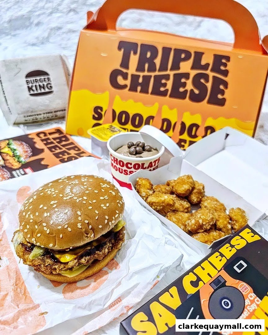 A Burger King meal featuring a burger, chicken nuggets, chocolate mousse, and promotional packaging.