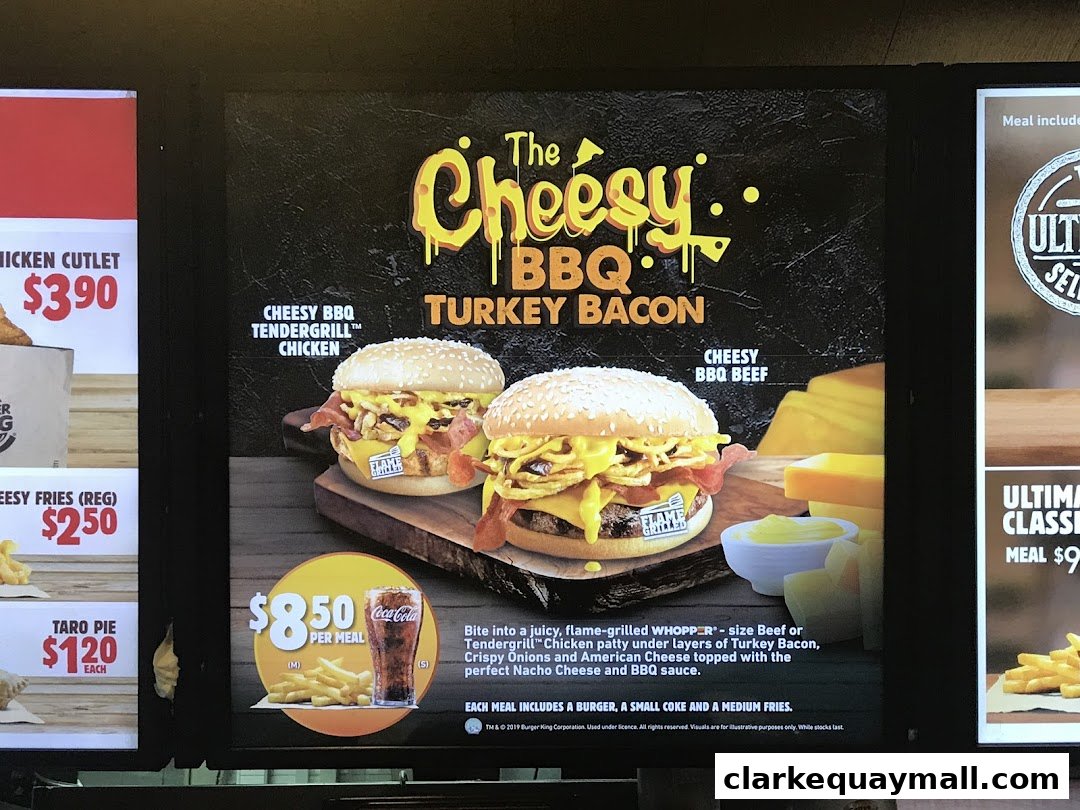 Burger King menu board featuring the Cheesy BBQ Turkey Bacon burgers and meal deals.
