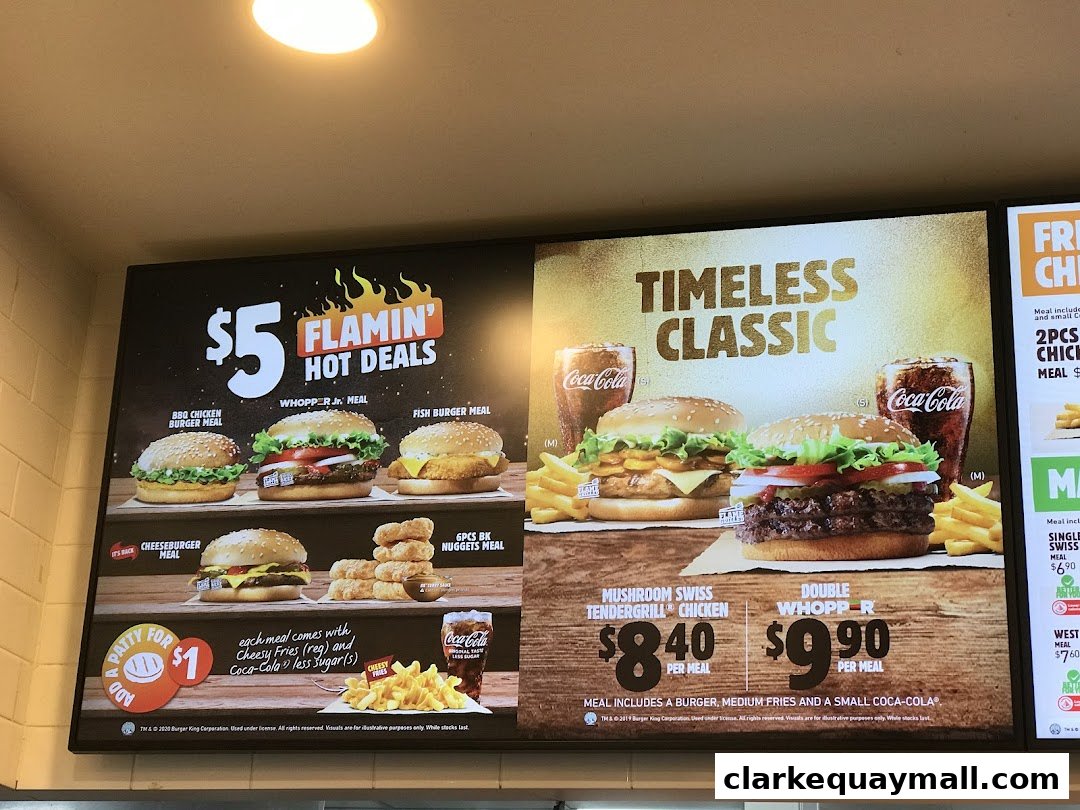 A menu board displaying Burger King's hot deals and classic burgers with prices.