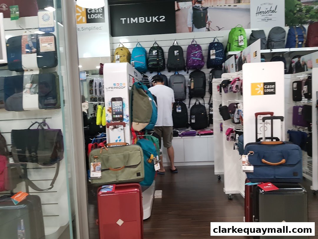A retail shop interior displaying a variety of bags, backpacks, and luggage.