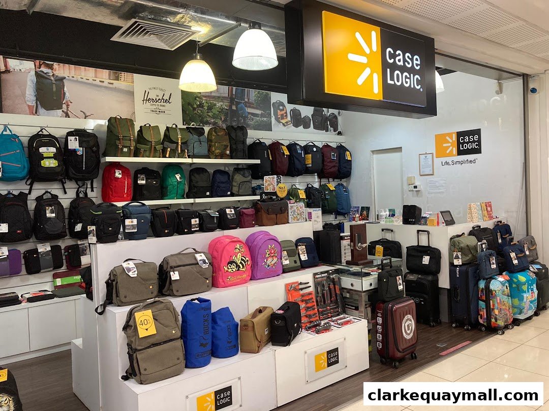 A retail store interior showcasing a wide variety of backpacks, luggage, and bags.