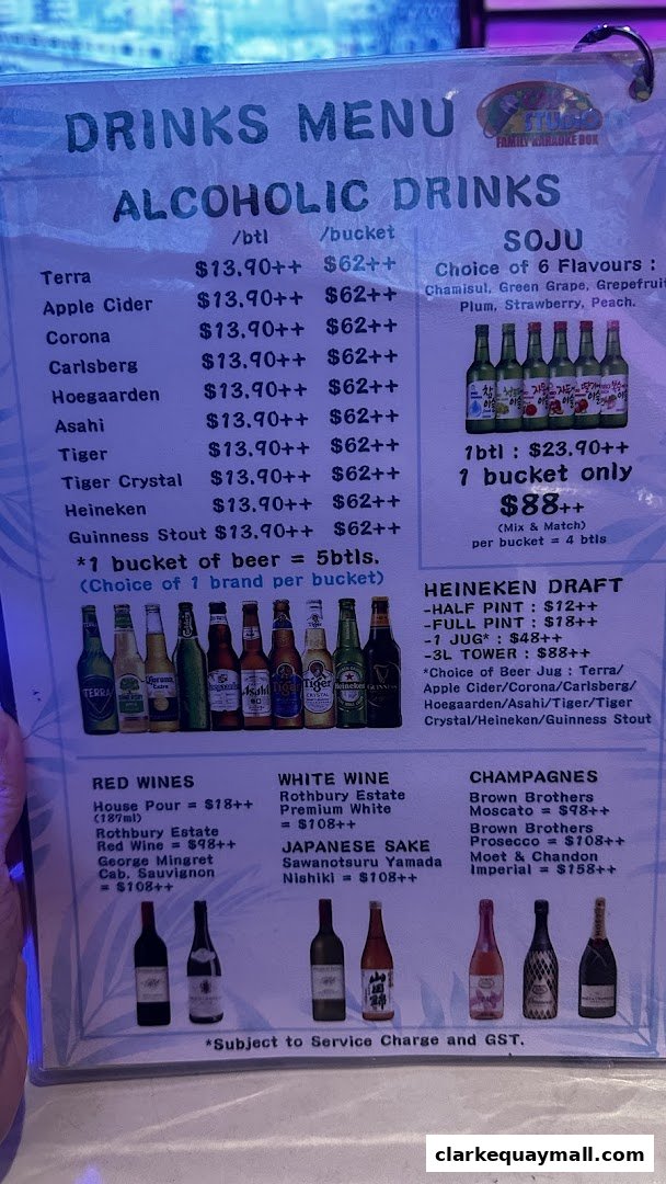 A drinks menu featuring alcoholic beverages including beers, wines, sake, and champagne.