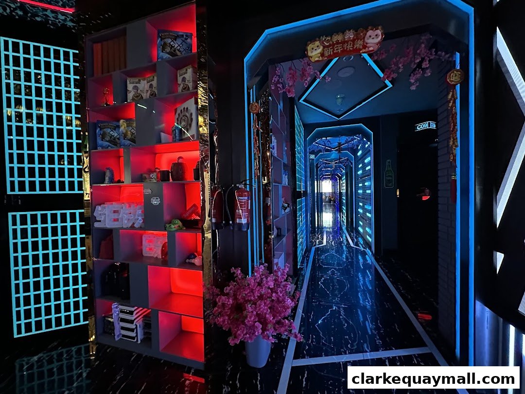 A dimly lit corridor with neon blue and red lights, showcasing shelves of items and decorative elements.