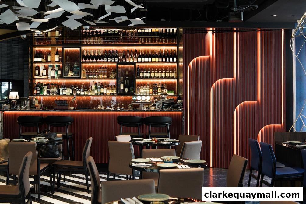 Interior of a stylish bar with a well-stocked liquor shelf, seating, and ambient lighting.