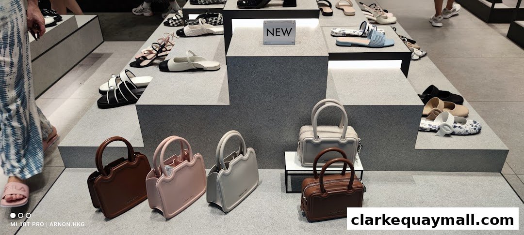 A display of new handbags and stylish sandals at Charles & Keith.