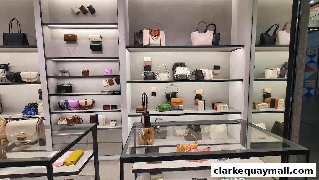 A well-lit retail display showcasing a variety of Charles & Keith handbags and accessories on shelves.