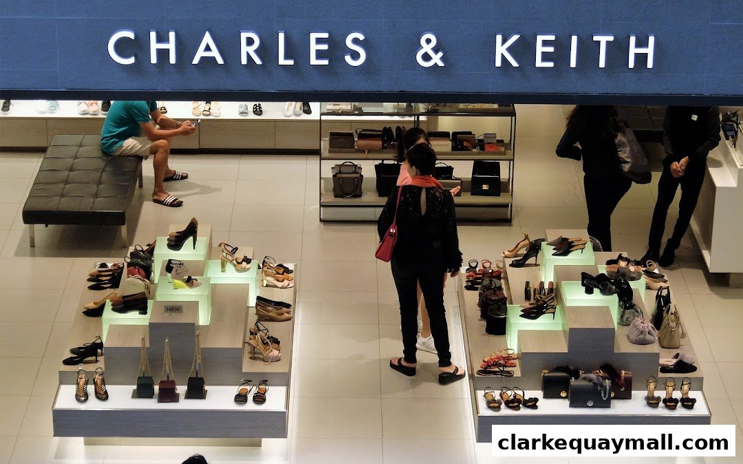 A view of the Charles & Keith store interior showcasing shoes and handbags with customers browsing.