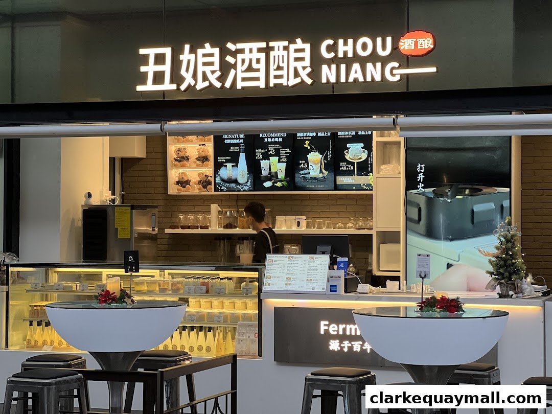 Chou Niang Fermented Rice shop front with illuminated signage and display cases.