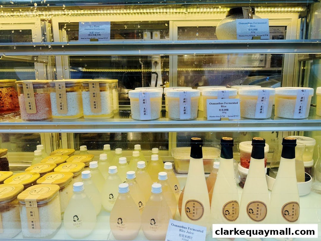 A display case filled with jars and bottles of fermented rice and rice juice.