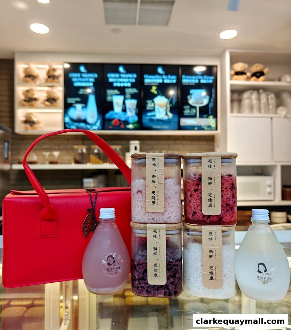 A red handbag and several jars of fermented rice products are displayed.