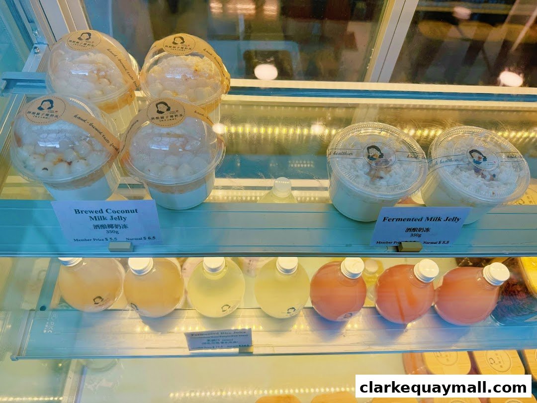 A display case filled with various jellies and drinks, featuring coconut milk jelly and fermented milk jelly.