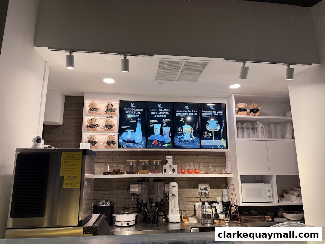 A display board showing drinks and desserts at Chou Niang Fermented Rice.