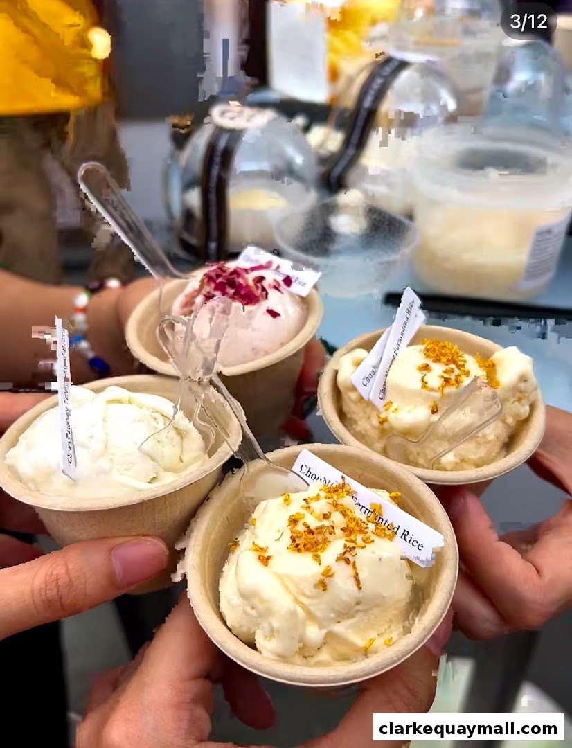 Hands holding cups of fermented rice ice cream with various toppings.