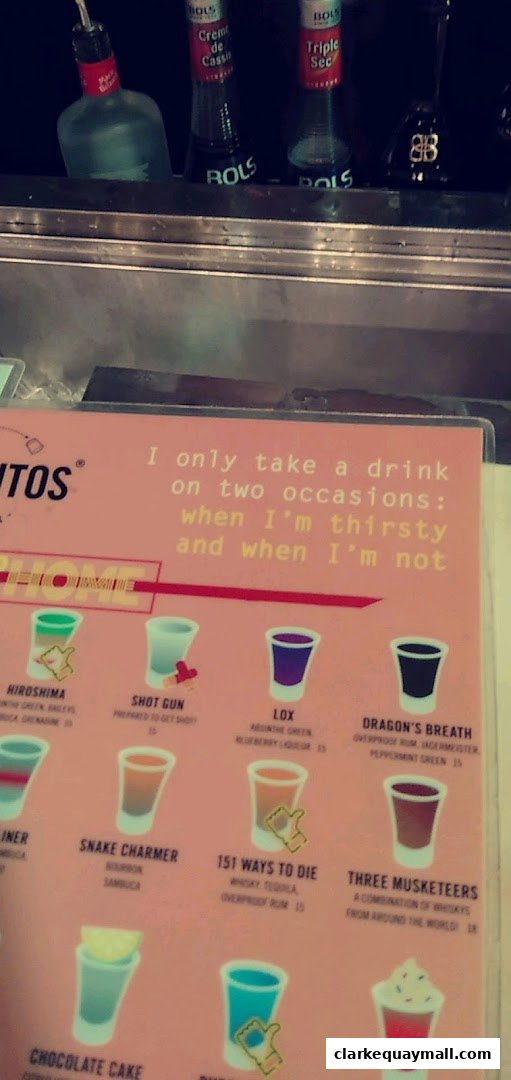 A menu from Chupitos featuring various shot drinks with illustrations and prices.