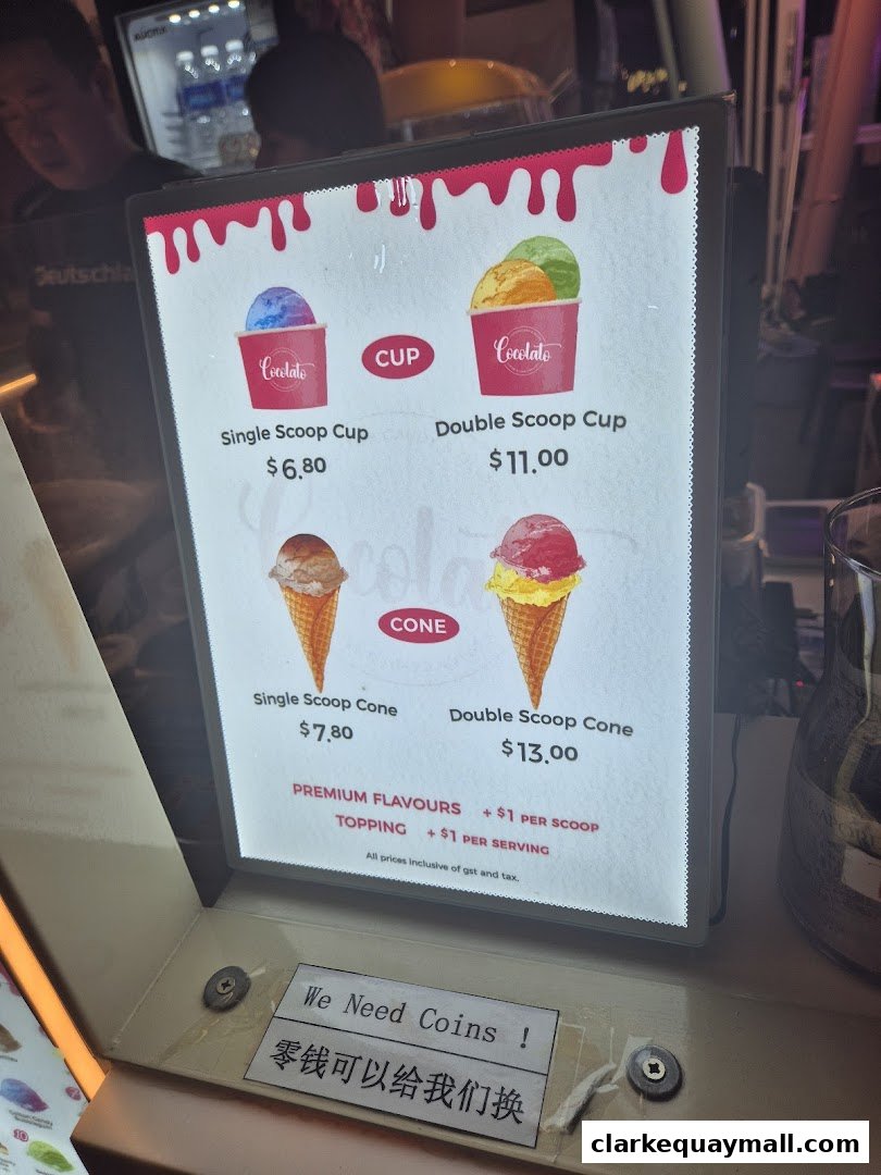 A menu board for Cocolato showing prices for single and double scoop ice cream cups and cones.