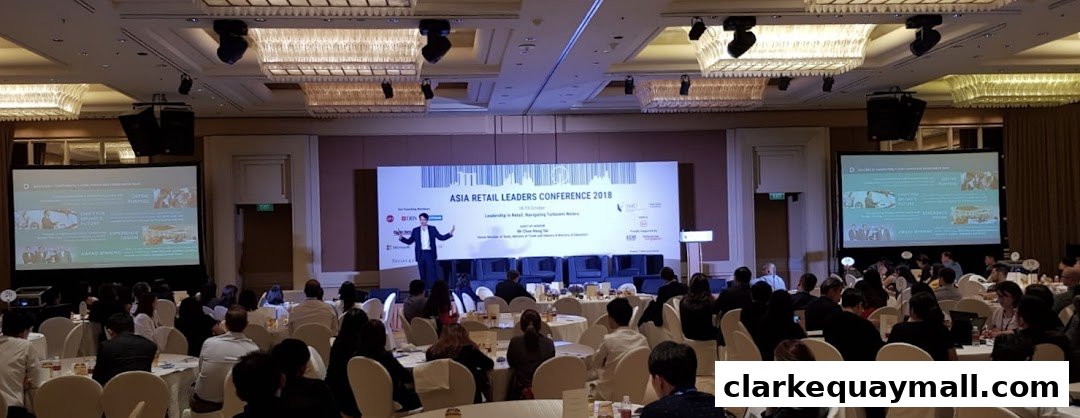 A speaker presents at the Asia Retail Leaders Conference 2018 to an audience seated at tables.