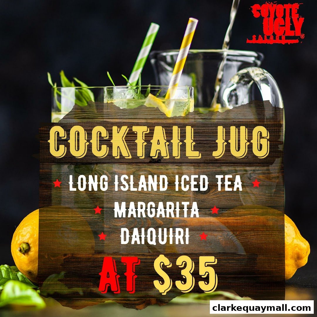 A cocktail jug with straws and lemons, advertising drink specials.