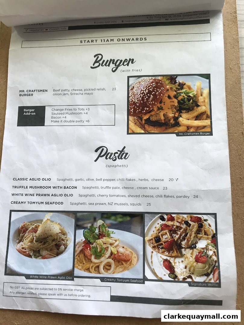A menu from Craftsmen Coffee featuring burgers, pasta dishes, and waffles with accompanying images.