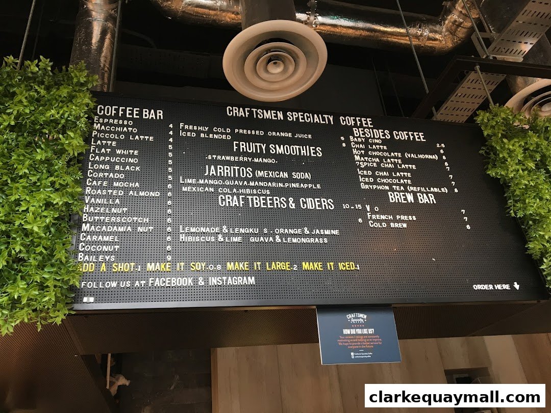 A large menu board for Craftsmen Coffee, displaying coffee, smoothies, and other beverages.
