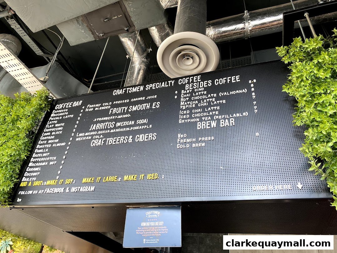 A menu board for Craftsmen Coffee, displaying coffee, drinks, and craft beers.
