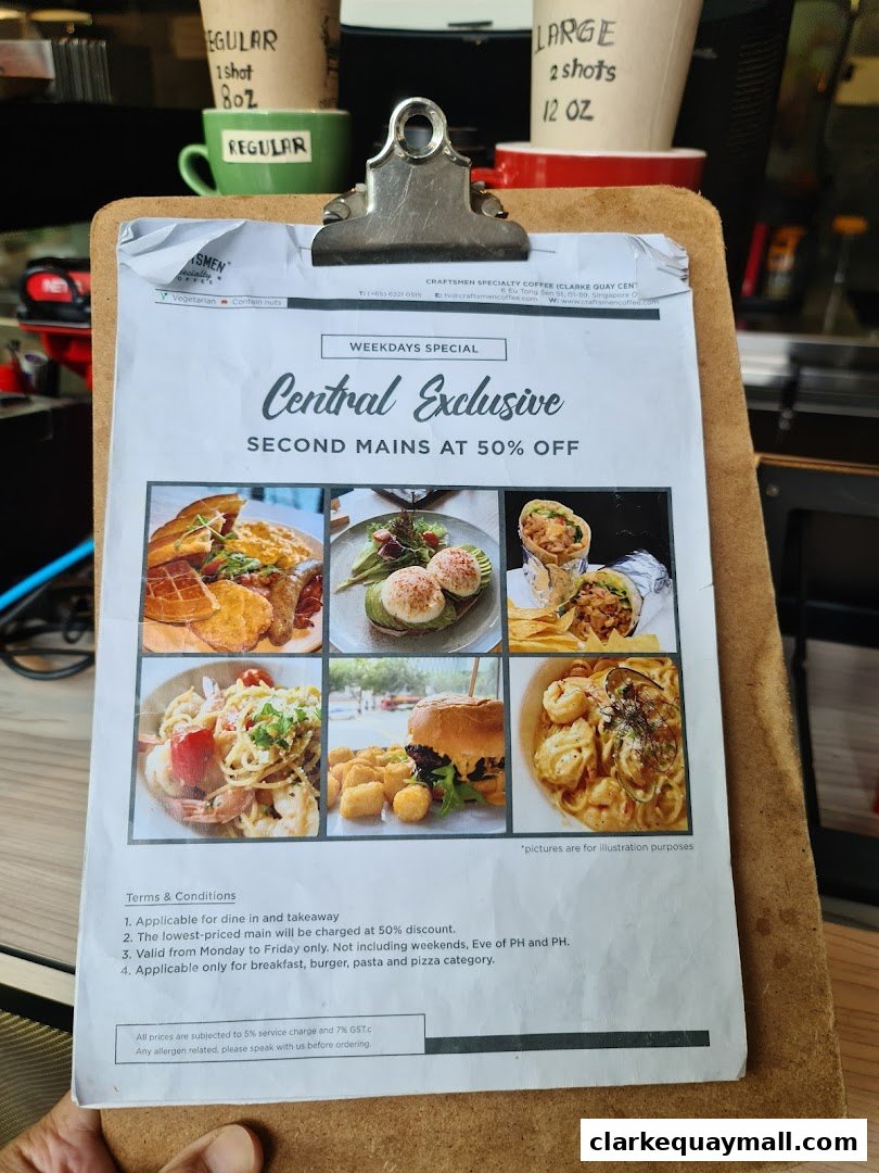 A menu board advertising a weekday special with 50% off second mains.