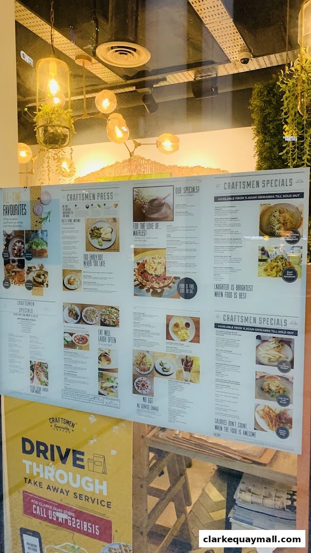 A menu board displaying various food and drink items with images and descriptions.