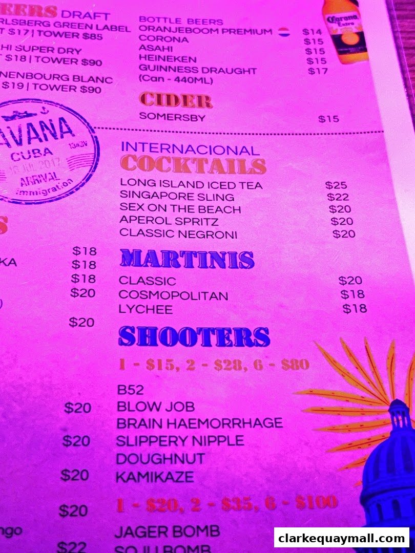 A menu for Cuba Libre Cafe Bar featuring cocktails, martinis, shooters, beers, and cider.