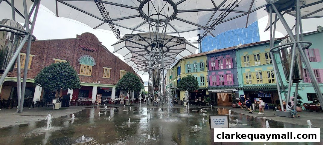 A vibrant street scene with colorful buildings, fountains, and people enjoying the outdoor space.
